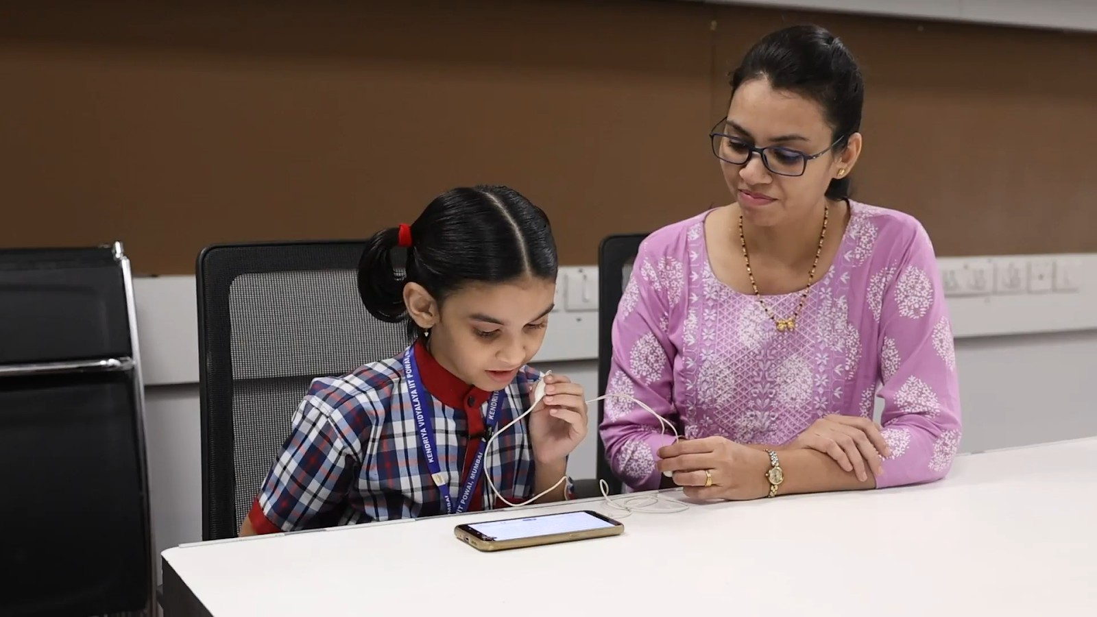 Teacher Facilitating the test of a student (Credits: Researchers)