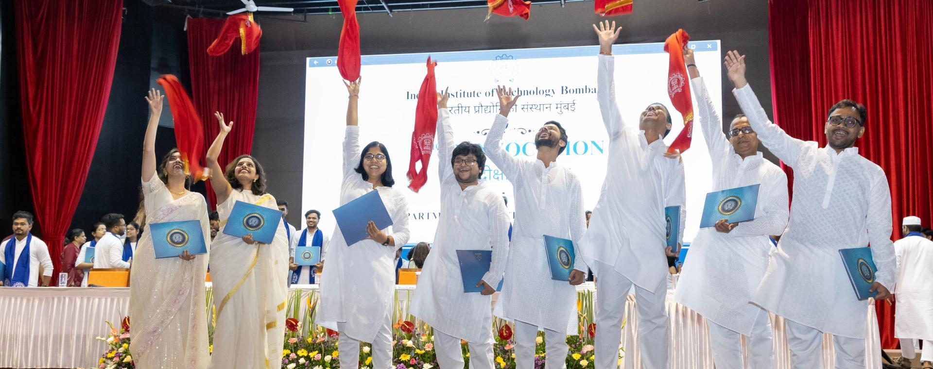 Ph.D. students celebrating their graduation